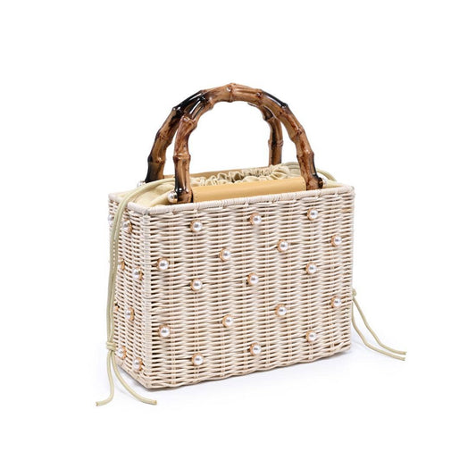 Wicker handbag with wooden handle on a white background