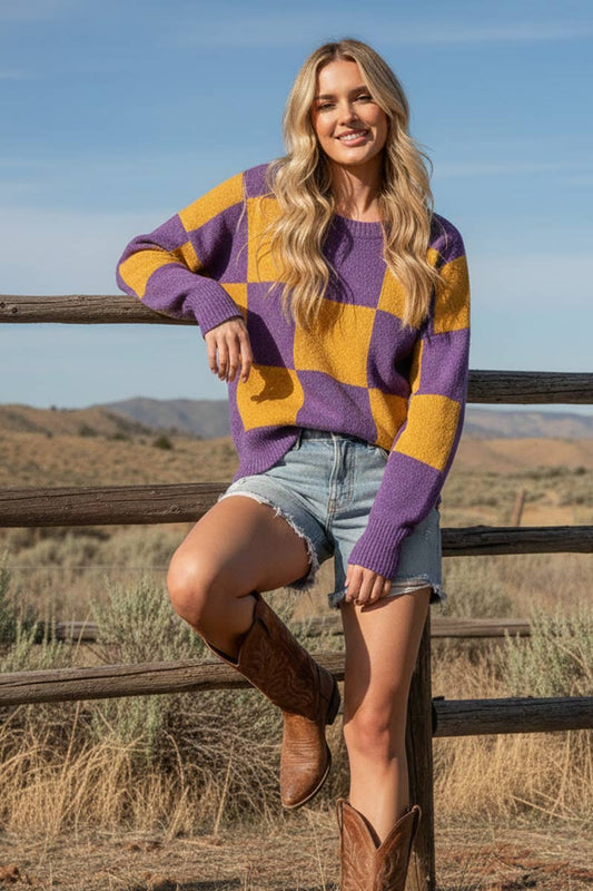 Woman wearing a relaxed purple and gold checkered crewneck sweater
