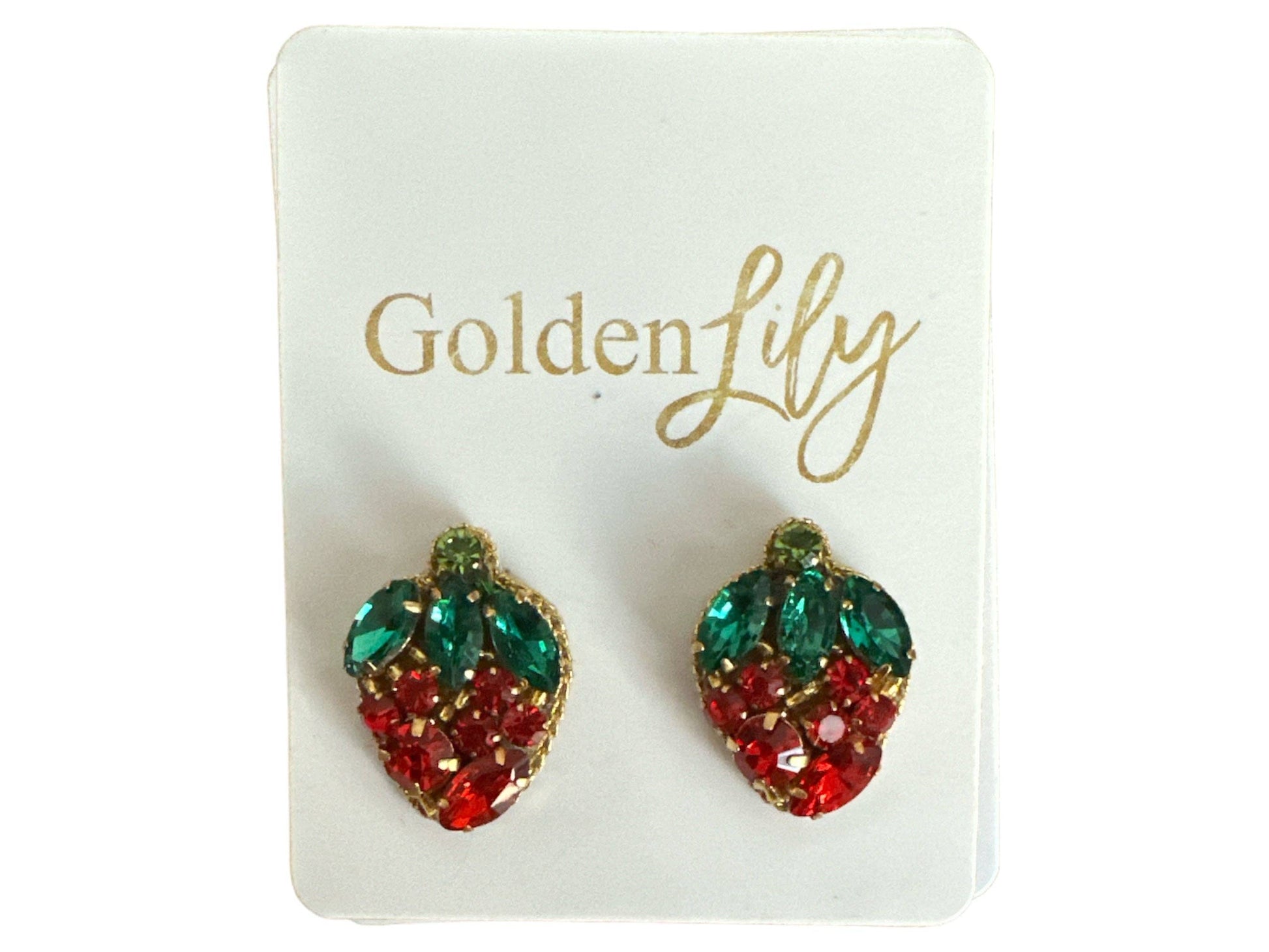 Red and green rhinestone strawberry statement earrings with crystal leaf accents and gold-tone trim displayed on jewelry cards.