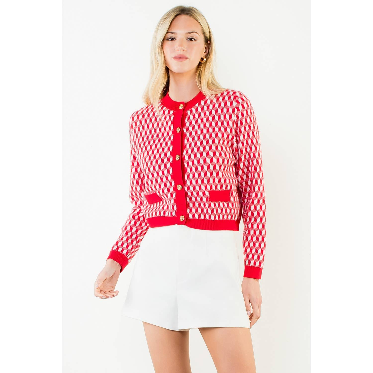 Woman wearing a red and white checkered cardigan with a white background