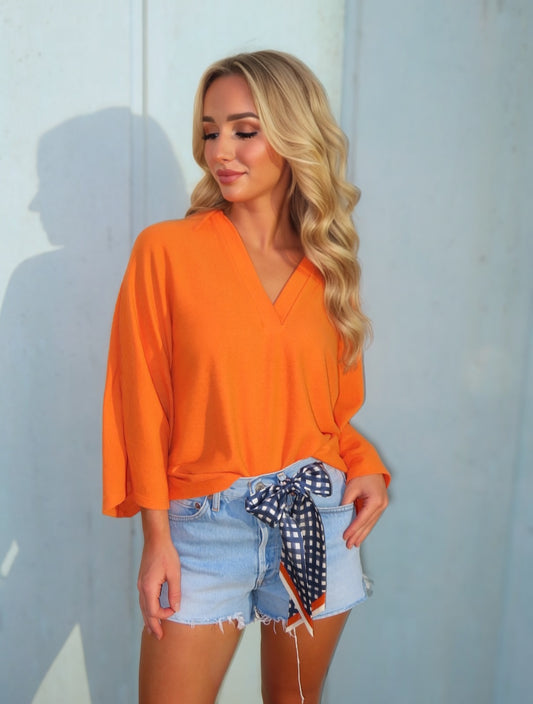 Schicke, orangefarbene, verkürzte, kastige Bluse im Oversize-Schnitt
