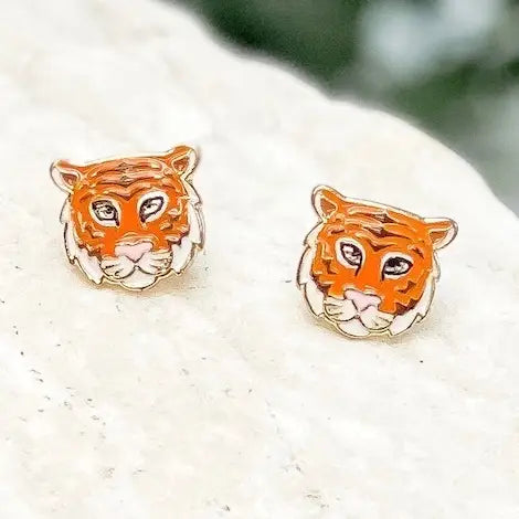 Petite orange, black and white tiger face enamel stud earrings with polished gold-tone outlines.