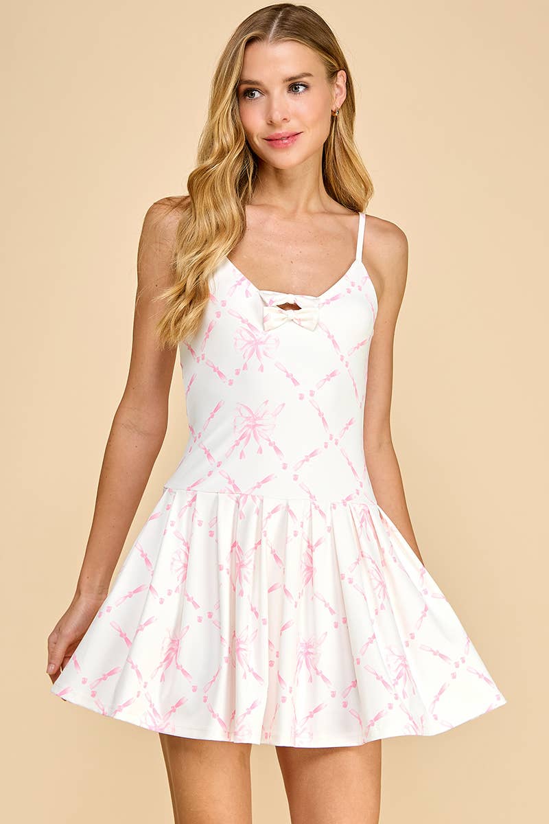 Woman wearing a white dress with pink floral pattern on a beige background
