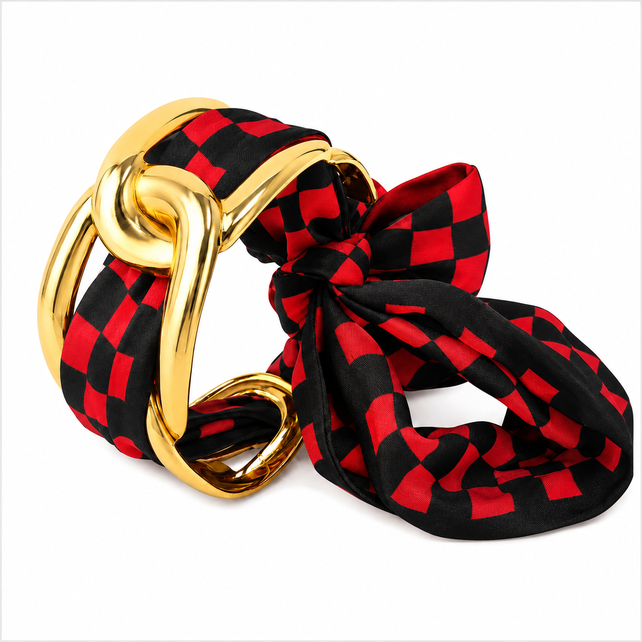 Gold-tone textured stainless steel cuff bracelet with a red and black checkered scarf woven through and tied into a statement bow.